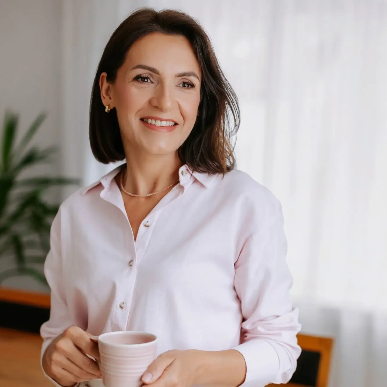 Edu Trenerka Dorota Burkowicz z filiżanką kawy